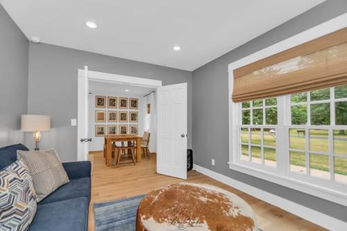 Modern Farm Home living room peeking into the dining room in Union Pier, MI.