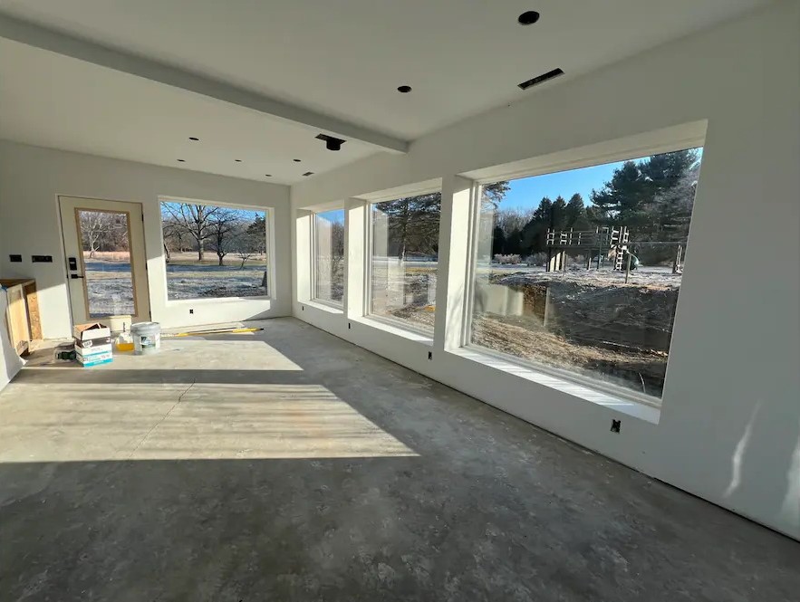 Mid-Century Modern Ranch living room, dining area, and kitchen in Union Pier, MI.