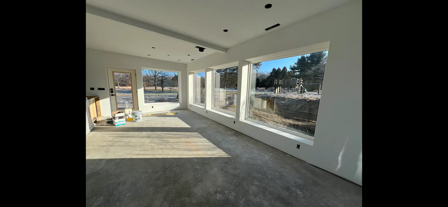 Mid-Century Modern Ranch living room, dining area, and kitchen in Union Pier, MI.